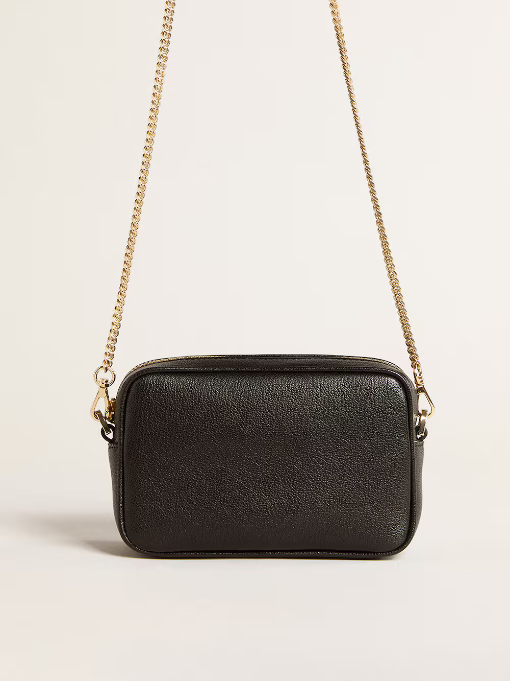 Mini Star Bag in pelle nera con stella tono su tono