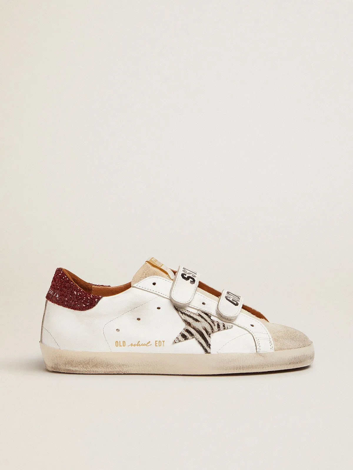 Old-School-Sneaker mit Ponyfell-Stern im Zebra-Print und rot glitzernder Fersenlasche