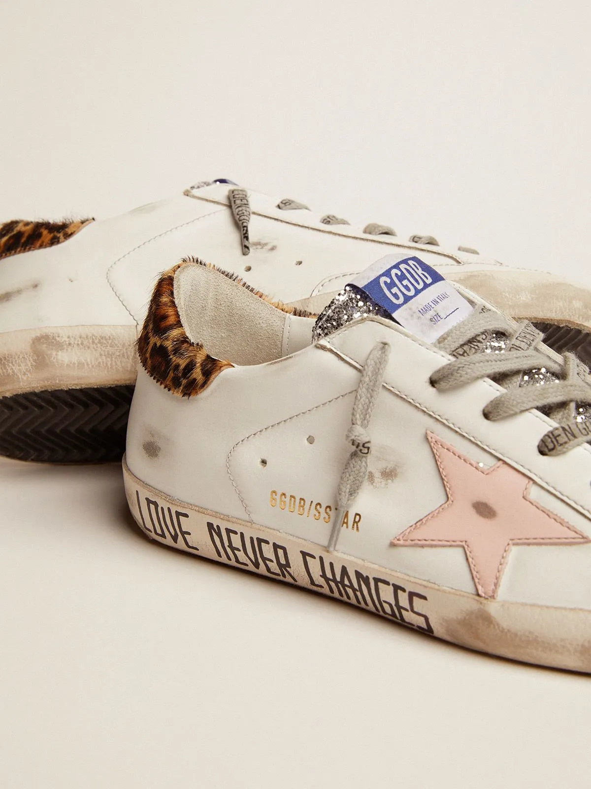 Super-Star sneakers with silver glitter tongue and handwritten lettering on the foxing