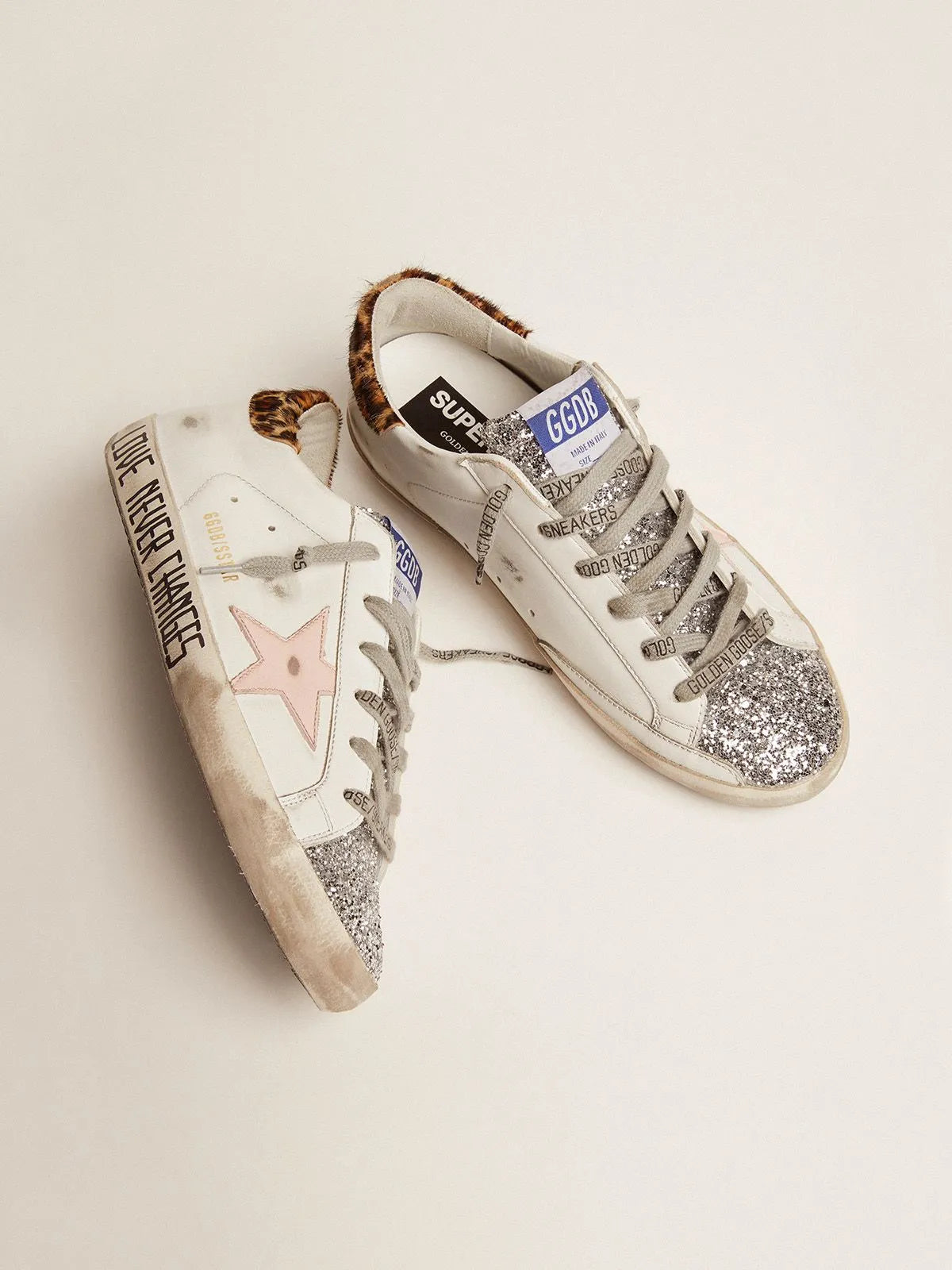 Super-Star sneakers with silver glitter tongue and handwritten lettering on the foxing