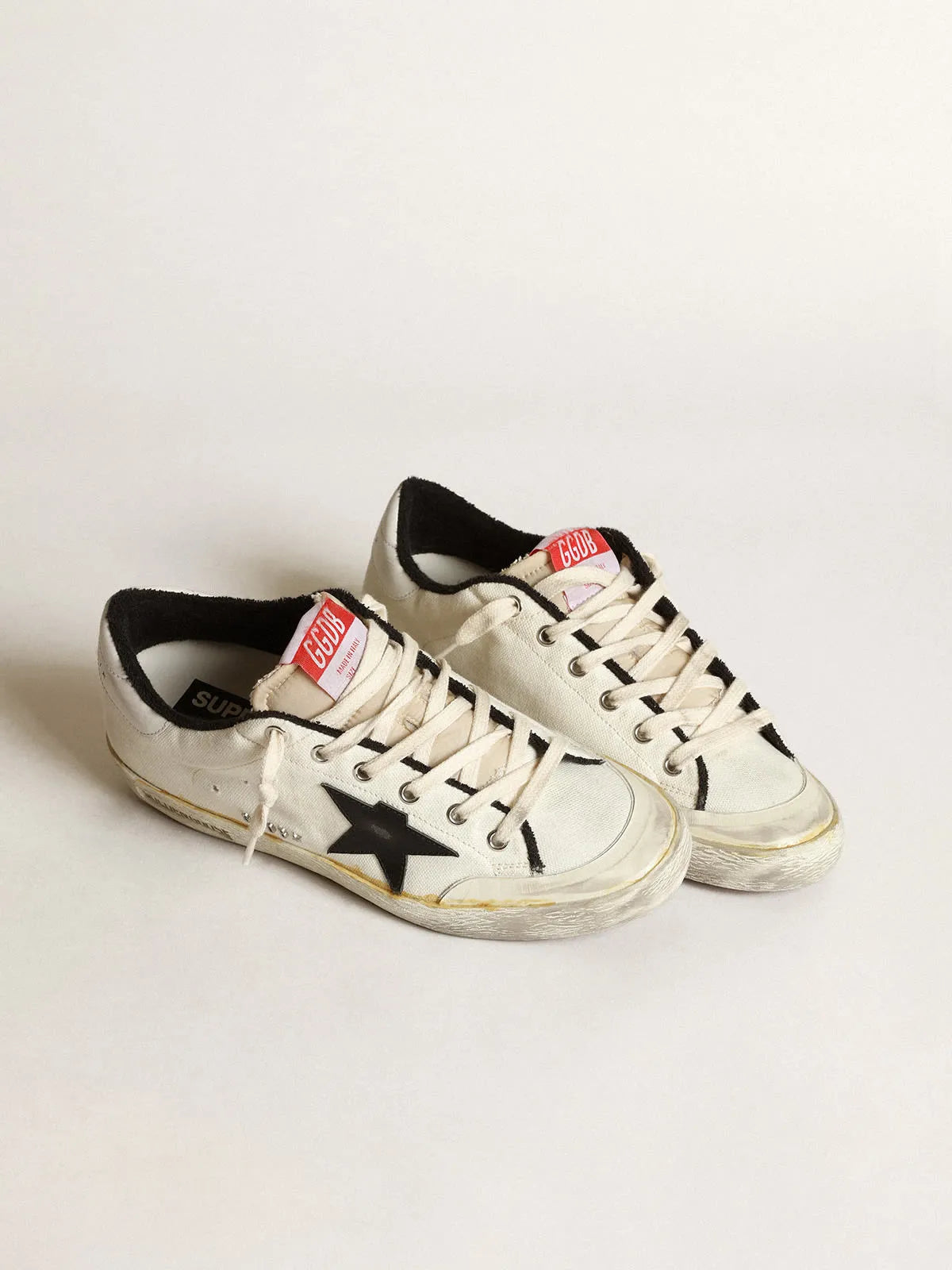 Deportivas Super-Star LTD para mujer en lona beige con estrella de piel negra y refuerzo del talón de piel blanca 