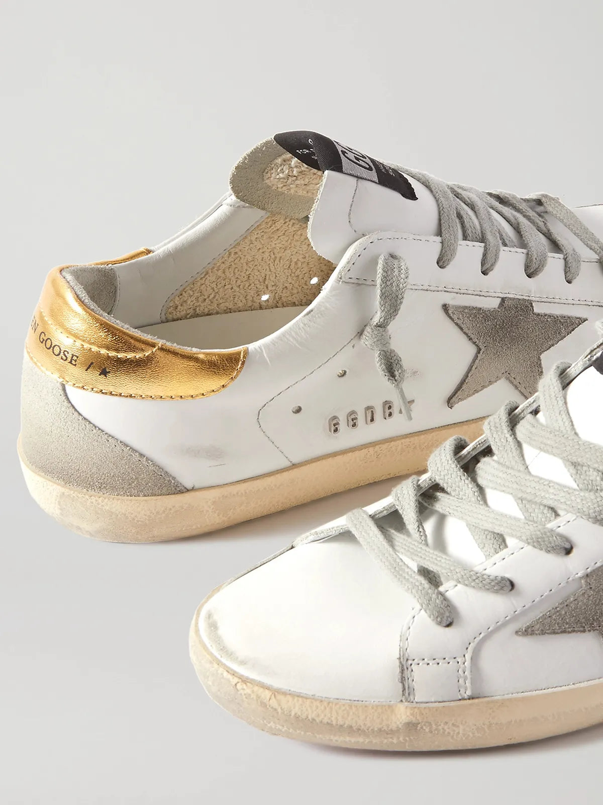 Superstar distressed leather and suede sneakers