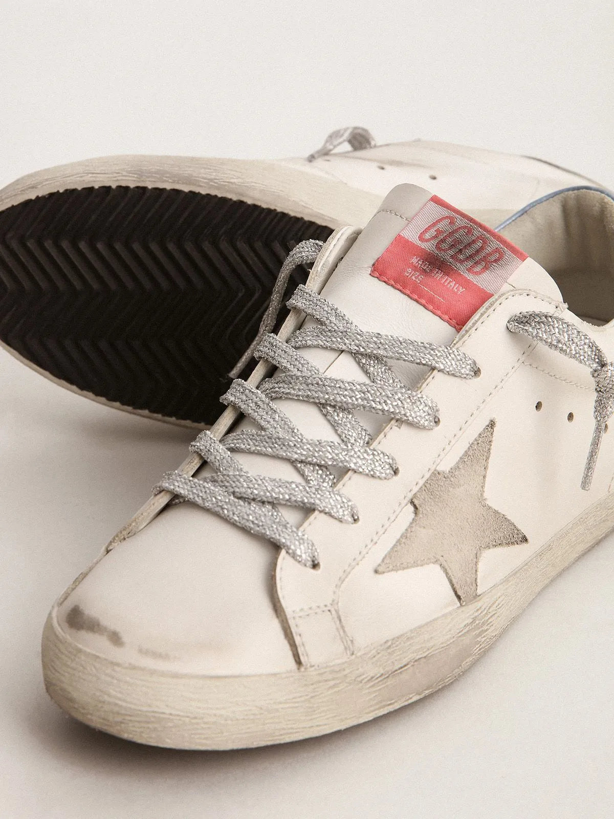 Super-Star sneakers with sky-blue laminated leather heel tab and ice-gray suede star