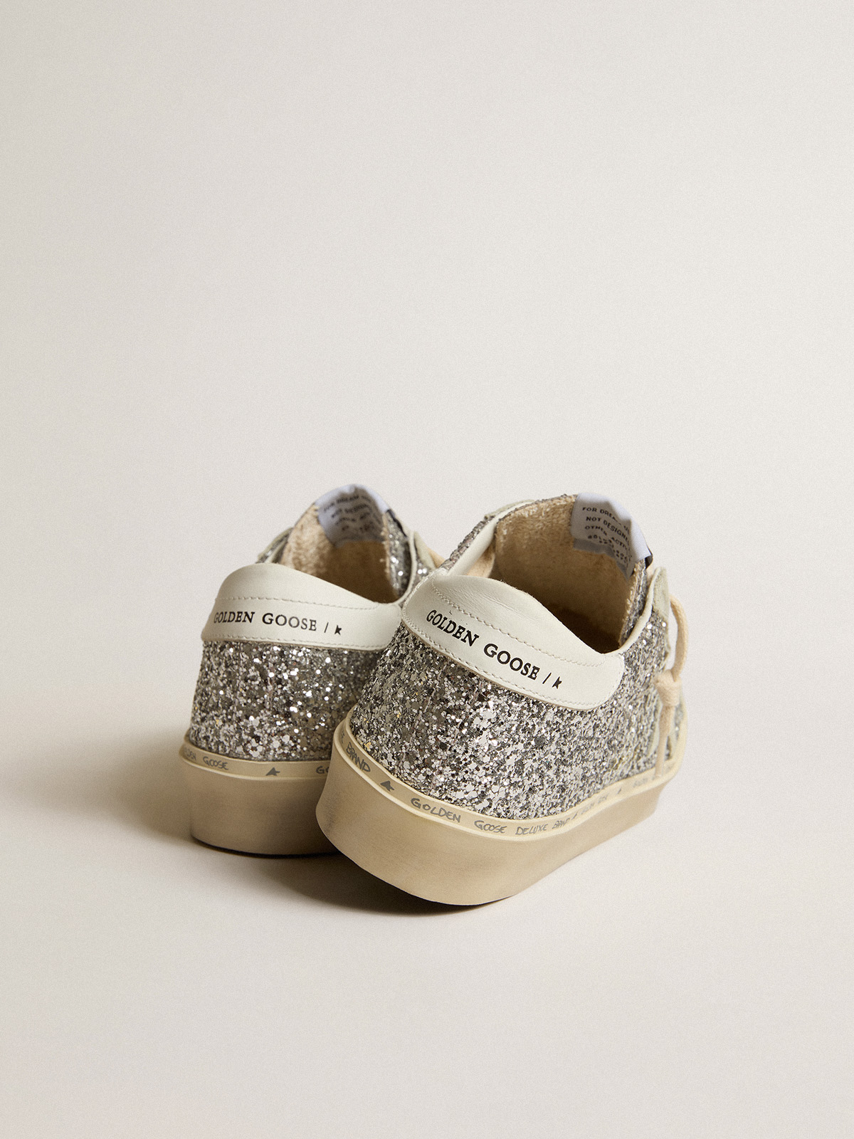 Hi Star in glitter argento con stella in suede e linguetta bianca sul tallone